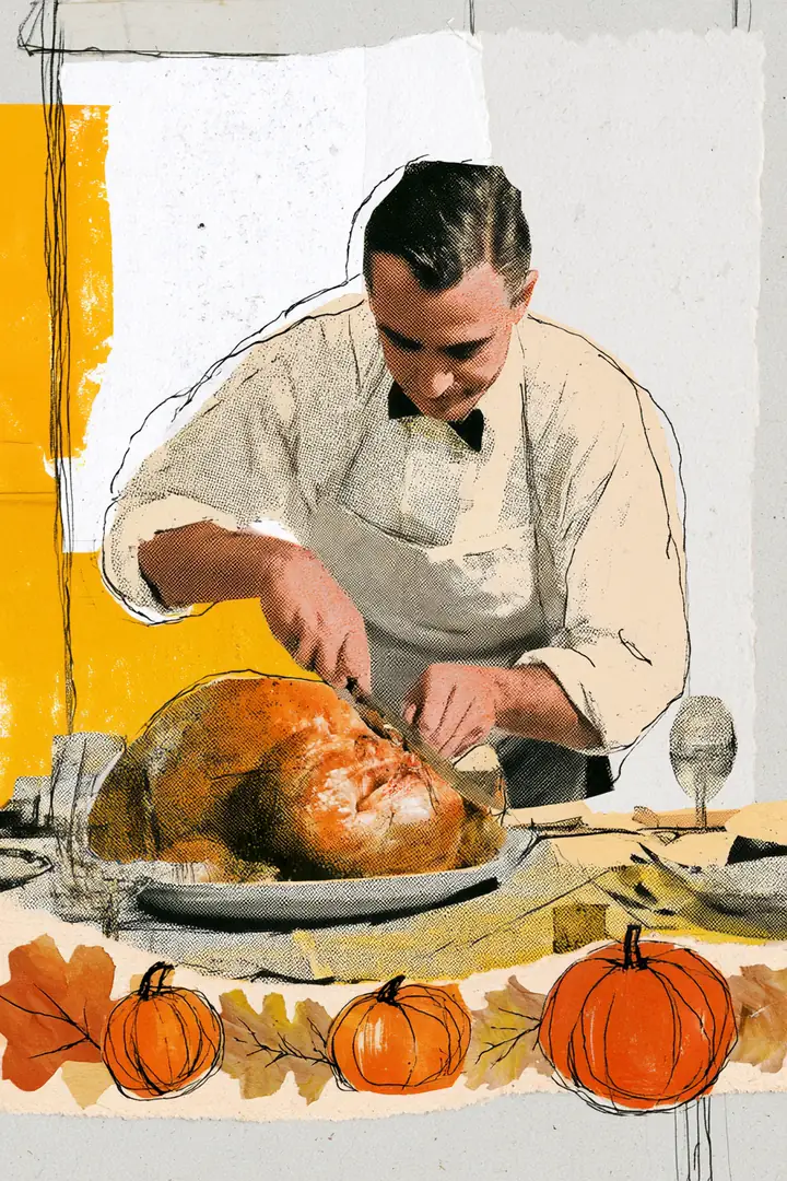 American man carving a turkey at the head of a dinner table as paper steam curls up from the platter